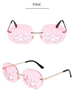 Detailed view of pink Halloween pumpkin sunglasses with hollow-out metal frames