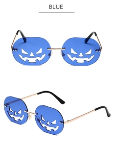 Detail view of Halloween pumpkin cutout sunglasses with blue lenses and gold metal frame