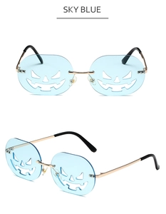 Detail of sky blue pumpkin lens sunglasses with hollow carving and gold metal frames
