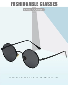 Detail of round punk sunglasses with black metal frame on geometric modern background