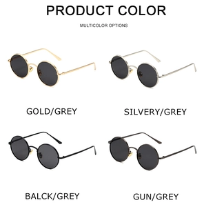 Detail showing four retro round metal sunglasses in gold silver black and gunmetal frames