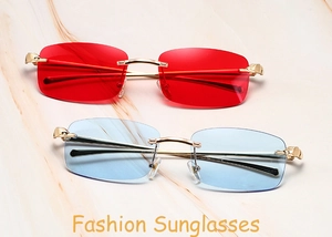 Detail of rimless rectangle sunglasses with red and blue lenses on marble surface
