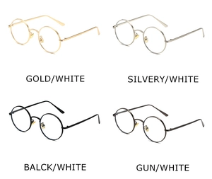 Detail view of round punk sunglasses in gold, silver, black, and gunmetal finishes
