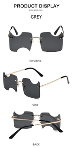 Detailed views of grey rimless notched lenses and gold metal temples on these sunglasses