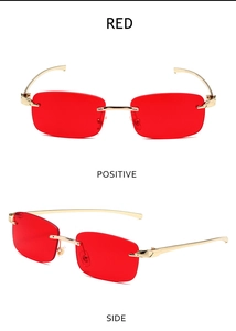 Macro detail of red rimless rectangular sunglasses with luxury gold leopard metal arms