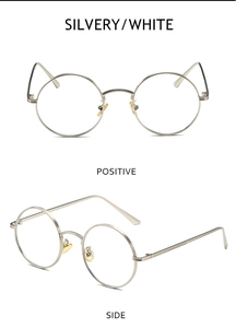 Detailed view of retro round silver metal sunglass frame showing front and side textures