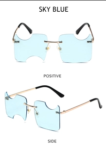 Sky blue rimless sunglasses with irregular cut edges and gold metal frame detailing