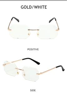 Detail view of gold and white rimless octagonal sunglasses with metal frame and sleek temples