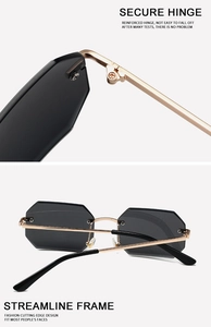 Detail view of secure metal hinges and gray rimless rectangular sunglasses for fashion