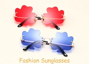 Detail view of rimless clover-shaped lenses in red and blue with gold metal frames