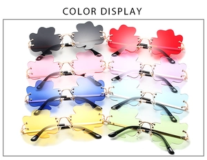 Matrix display of rimless clover-shaped sunglasses in eight vibrant assorted colors