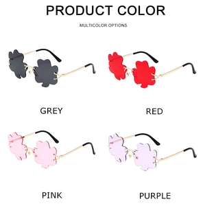 Detailed view of four colorful clover-shaped rimless sunglasses with gold metal temples