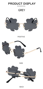 Detailed views of grey cloud-shaped rimless sunglasses with gold metal frame