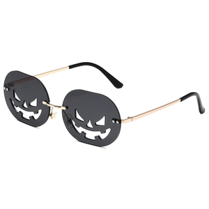 Halloween pumpkin sunglasses with gold metal frame and black jack-o'-lantern shaped lenses