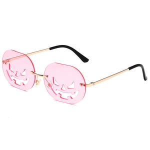 Halloween pumpkin shaped rimless sunglasses with pink lenses and gold metal temples