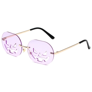 Halloween pumpkin hollow metal sunglasses with purple lenses and gold frame in 45-degree view