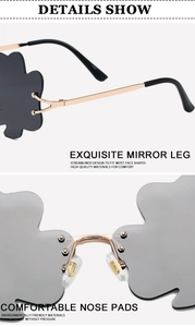 Detail of grey rimless cloud sunglasses showing golden metal hinges and nose pads