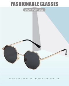 Detail of vintage octagonal sunglasses with gold metal frame and dark gray lenses