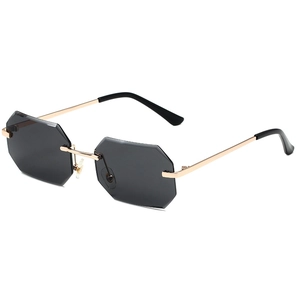 Minimalist rimless octagonal sunglasses with grey lenses and gold metal temples