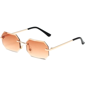 Modern rimless octagonal sunglasses with orange gradient lenses and gold metal frame