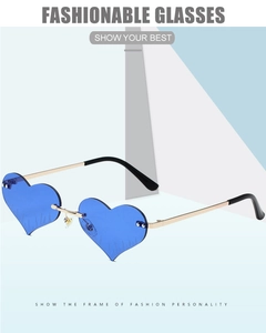 Detail of blue heart-shaped rimless sunglasses with gold temples and flame pattern