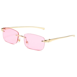 Luxury rimless sunglasses with pink lenses and golden leopard head metal temples