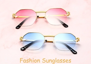 Detail view of retro semi-rimless sunglasses with gold frames and gradient lenses