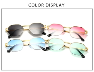 Detailed color display of vintage metal half-frame sunglasses with gradient lenses