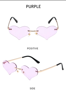 Macro detail of rimless heart-shaped purple sunglasses with golden metal frame