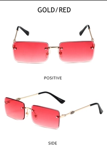 Detail view of gold metal hinges and red gradient lenses on rimless square sunglasses