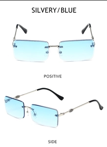 Detail of rimless rectangle sunglasses with blue lenses and engraved silver metal temples