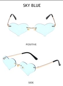 Detail view of sky blue heart-shaped rimless sunglasses with gold metal frame