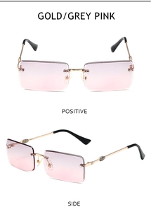 Macro detail of rimless rectangular sunglasses with gold metal temples and pink gradient lenses
