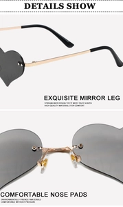 Detail view of heart-shaped rimless sunglasses featuring golden hinges and comfortable nose pads