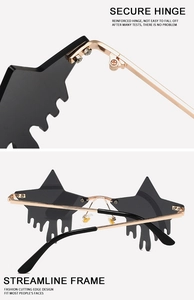 Detail of star-shaped rimless sunglasses with teardrop lenses and reinforced gold hinges