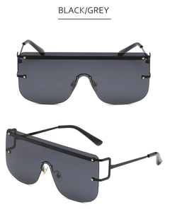 Front and side view of black frame oversize sunglasses with gold stud details