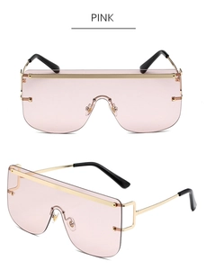 Pink oversized wrap-around sunglasses with golden top frame and integrated lens detail