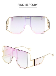 Detail view of pink mercury gradient lenses and gold rivet metal frame on sunglasses