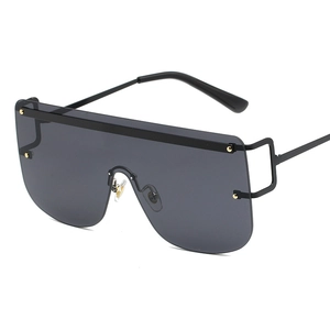 Modern oversized shield sunglasses with black metal frame and gold rivet accents