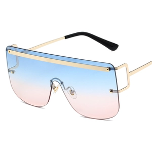 Trendy oversized shield sunglasses with gradient blue-pink lenses and gold metal frame