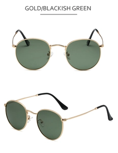 Detailed view of round gold metal sunglasses with blackish green polarized lenses