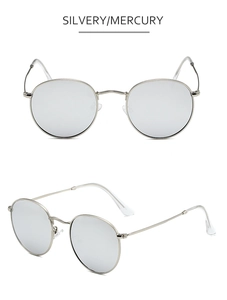 Detail view of round silver metal sunglasses with reflective mercury mirror lenses