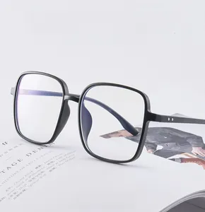 Detail of lightweight TR90 square black frame glasses on a magazine background