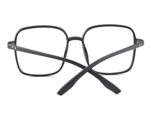 Detail view of square black TR90 eyewear frames featuring stylish silver double dot rivets