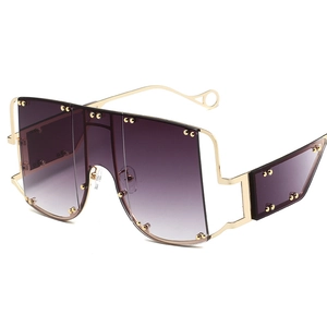 Punk style oversized sunglasses with purple gradient lenses and gold rivet detailing