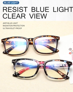 Detail of blue light blocking lenses with leopard and floral frames showing blue reflection