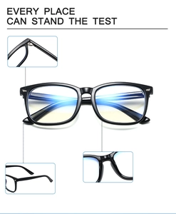 Detail of black full-rim glasses showing anti-blue light coating and durable metal hinges