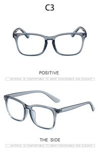 Detail view of grey translucent rectangular eyeglass frames with side temple profile