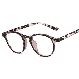 Classic round TR90 tortoiseshell glasses frame with silver metal rivets at 45-degree angle
