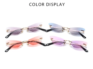Detail view of four dragonfly wing sunglasses in various gradient colors on white background